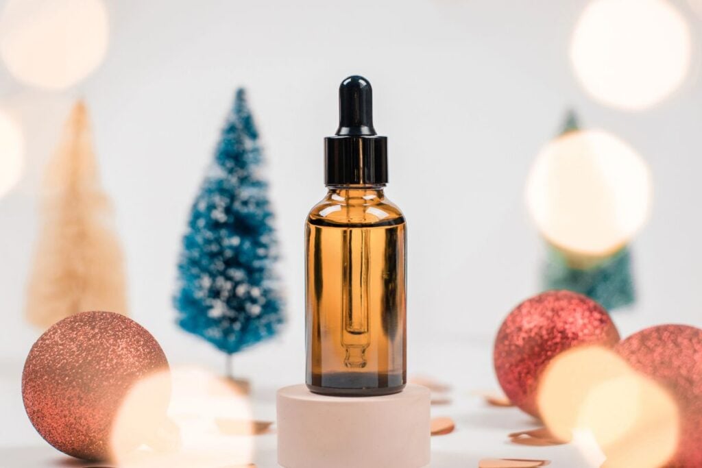 Oil with holiday bulbs in background