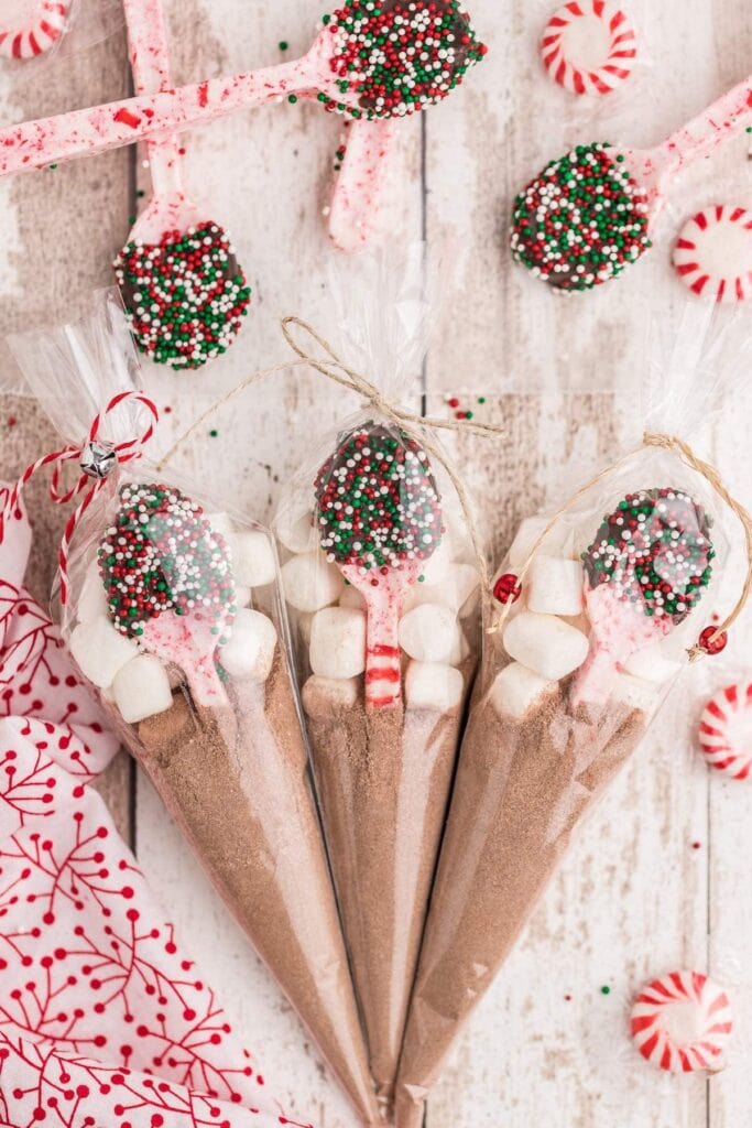 peppermint candy spoons on wood background