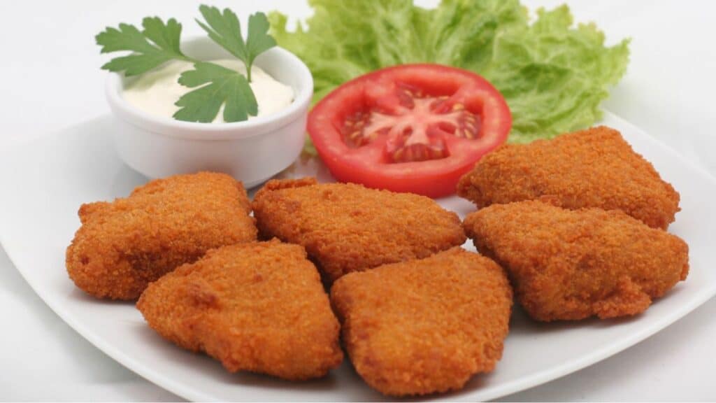 Copycat Wendy's spicy nuggets on a white plate.
