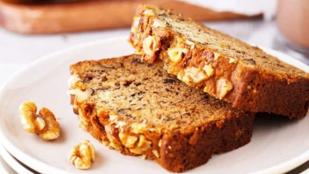 Two slices of Banana Bread on a white plate.