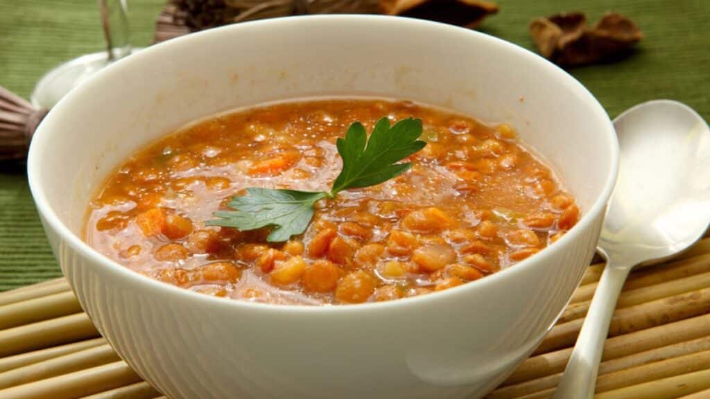 Lentil stew in a white bowl.