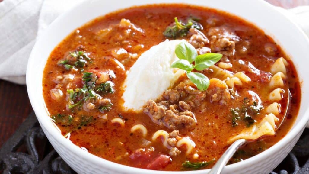 Creamy lasagna soup in a white bowl.