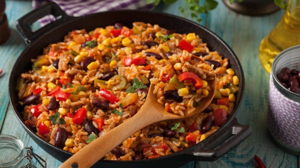 Texmex taco rice in a black skillet.