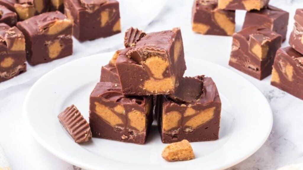 Reese's Fudge stacked on a plate.