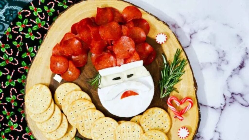 Santa charcuterie board on a wood background.