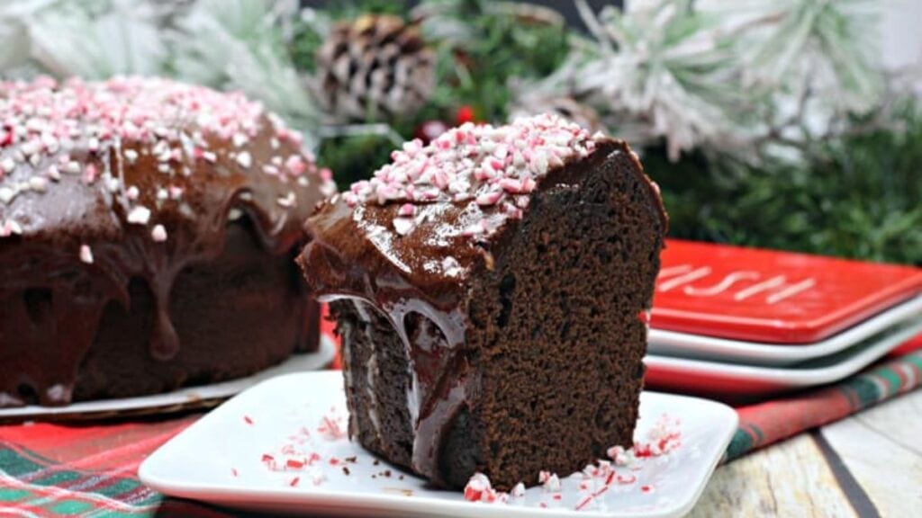 A chocolate mocha cake with espresso ganache and candy cane topping.