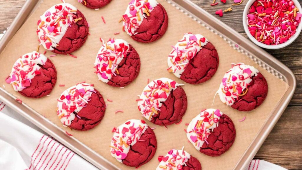 Red velvet cookies with white chocolate dip on the side.