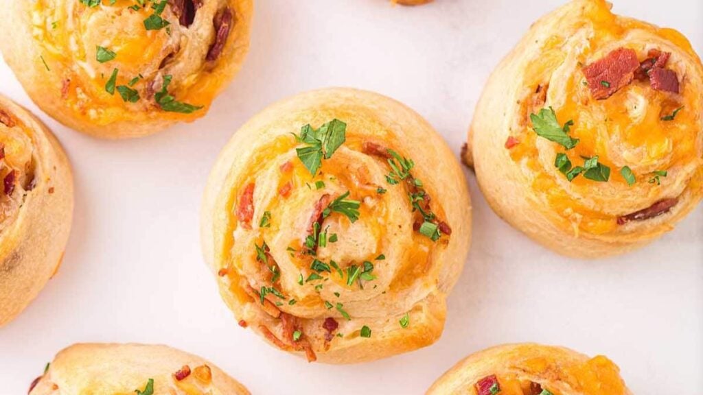 Crescent roll pinwheels filled with cheddar cheese and bacon. 