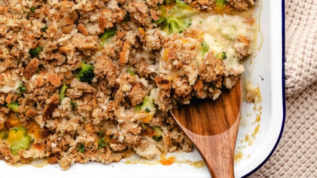 Stuffing mixed with chicken and broccoli in a casserole dish.