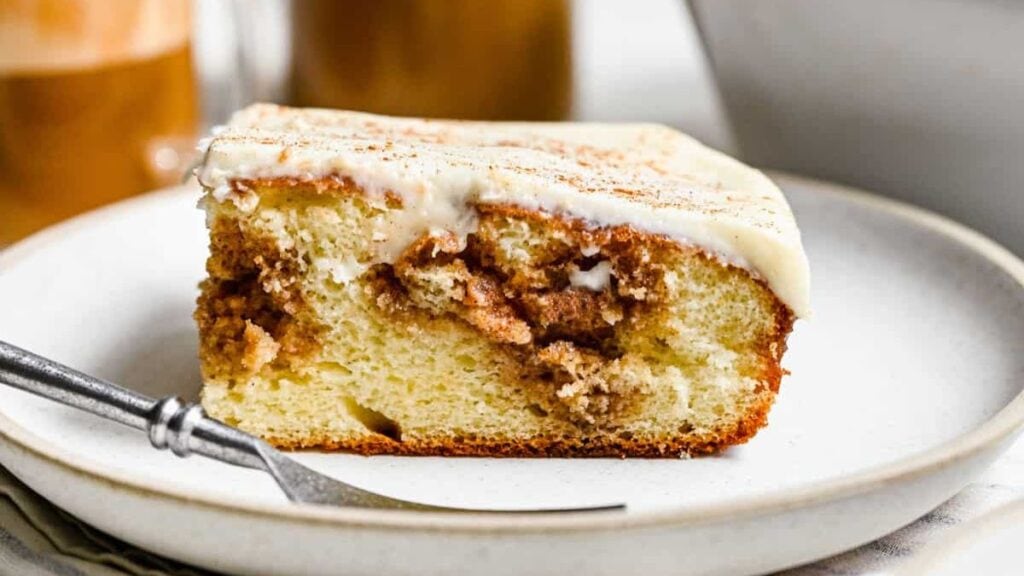 Cinnamon roll flavored cake with white icing.