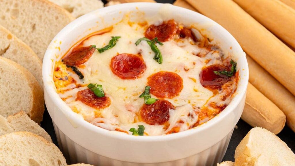 Pizza dip with breads on the side.