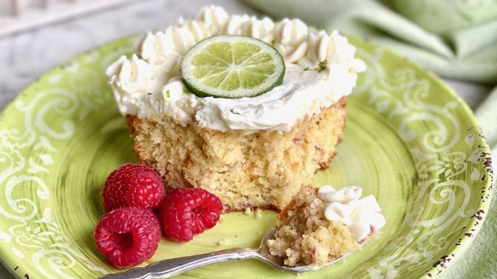 Key lime flavored poke cake on a green plate.