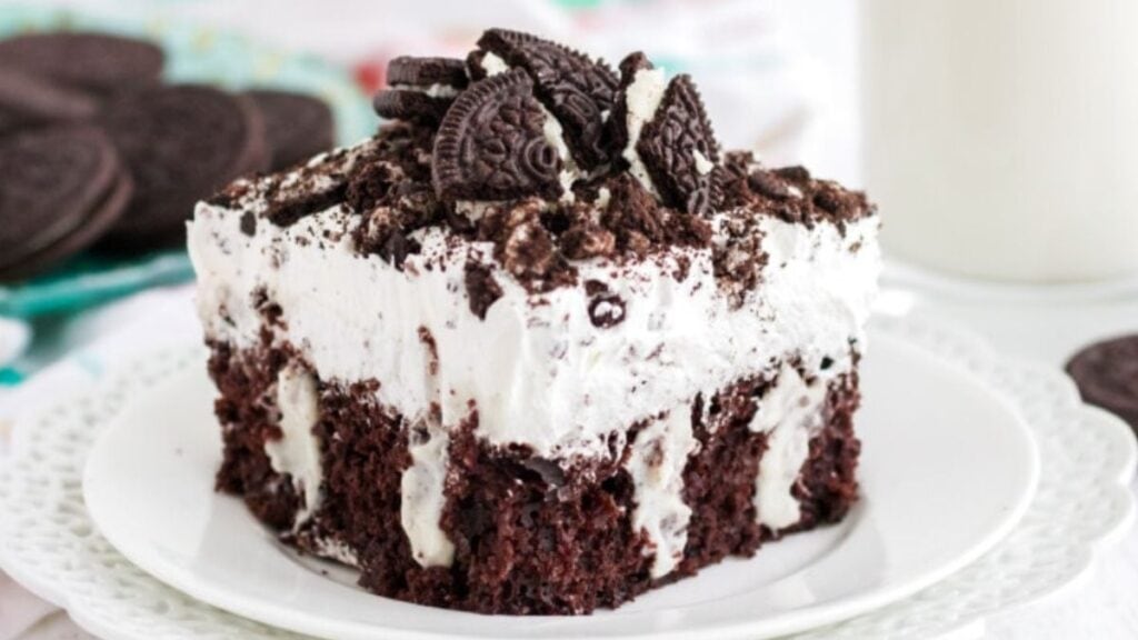 Slice of Oreo poke cake on a plate.