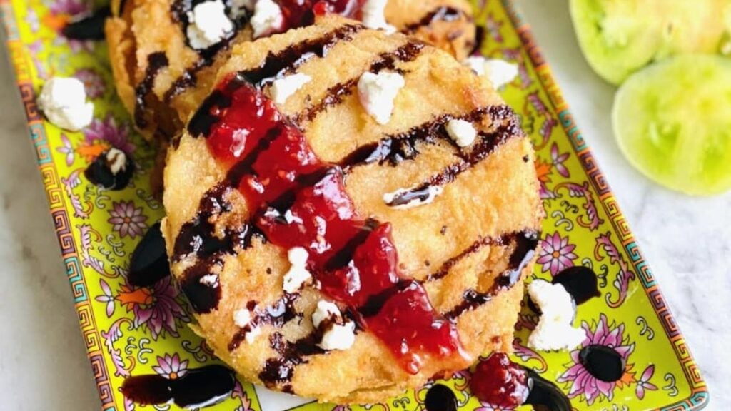 Fried green tomatoes drizzled with balsamic and jam.