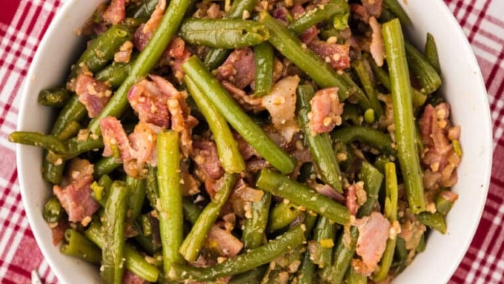 A dish of southern green beans on the side.