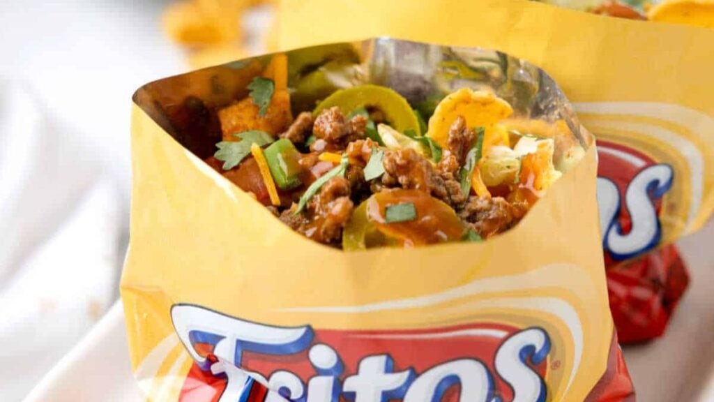A seasoned taco beef mixture in a Fritos bag. 