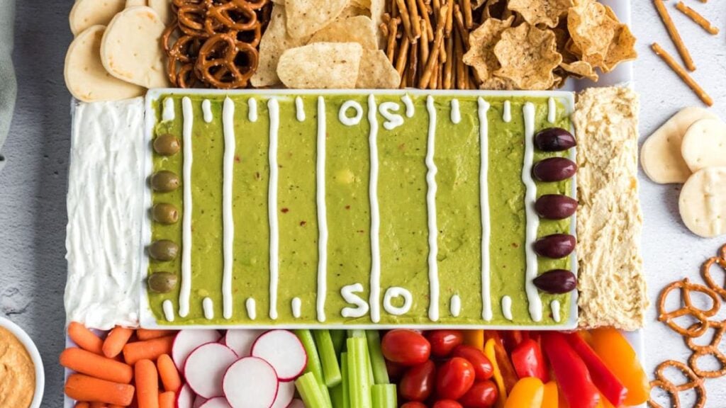 Guacamole that looks like a football field with chips.