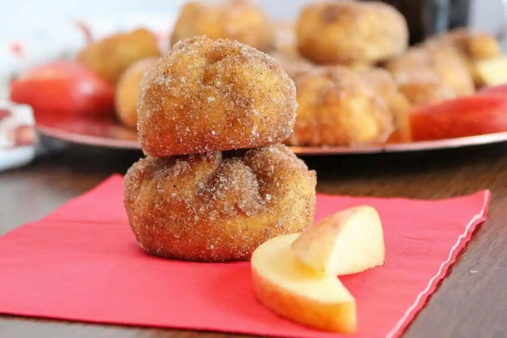Image of apple bites next to slices of apples.