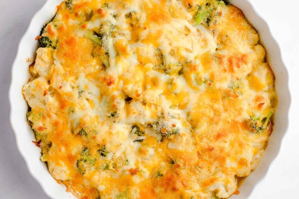 Broccoli cauliflower casserole on a white deep plate.