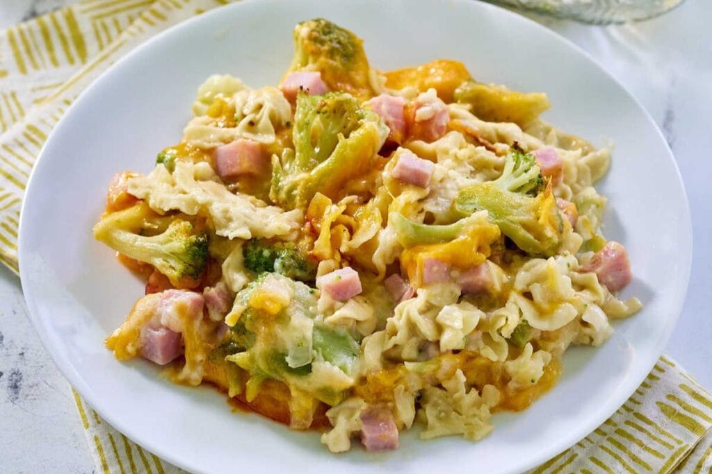 Cheesy ham and broccoli casserole on a plate.