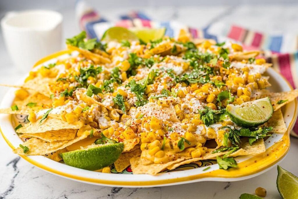 Street corn nachos with elote flavors on a plate.