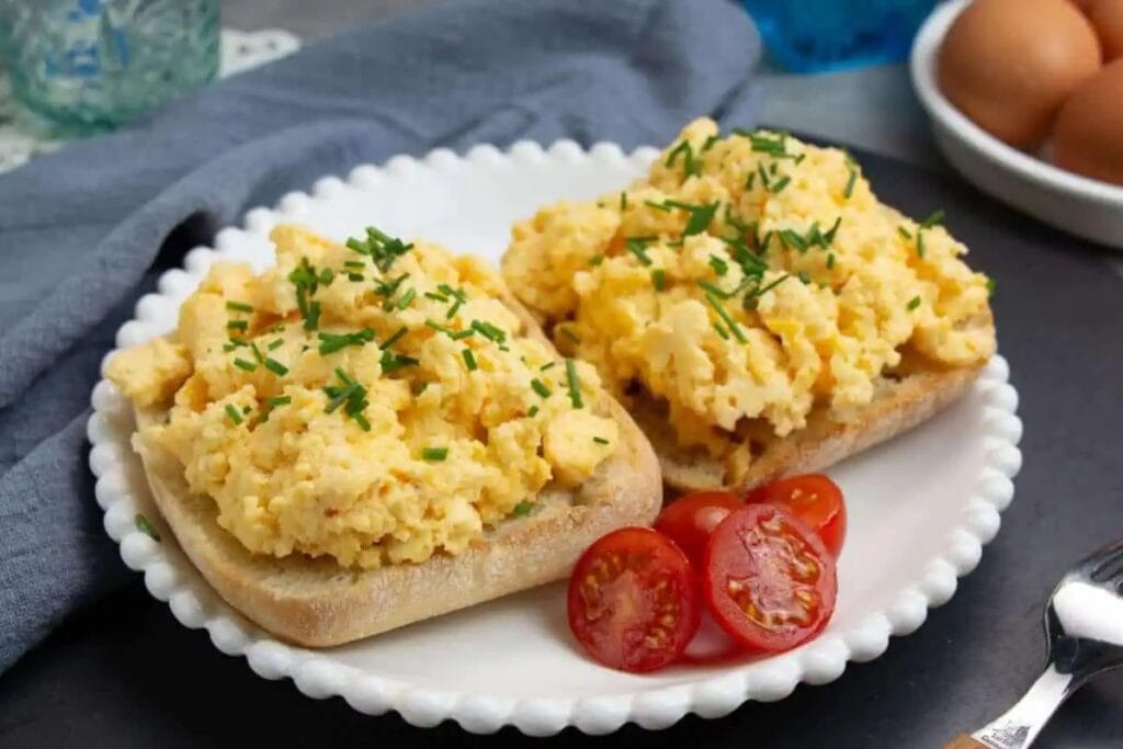 Scrambled eggs topped on toast.