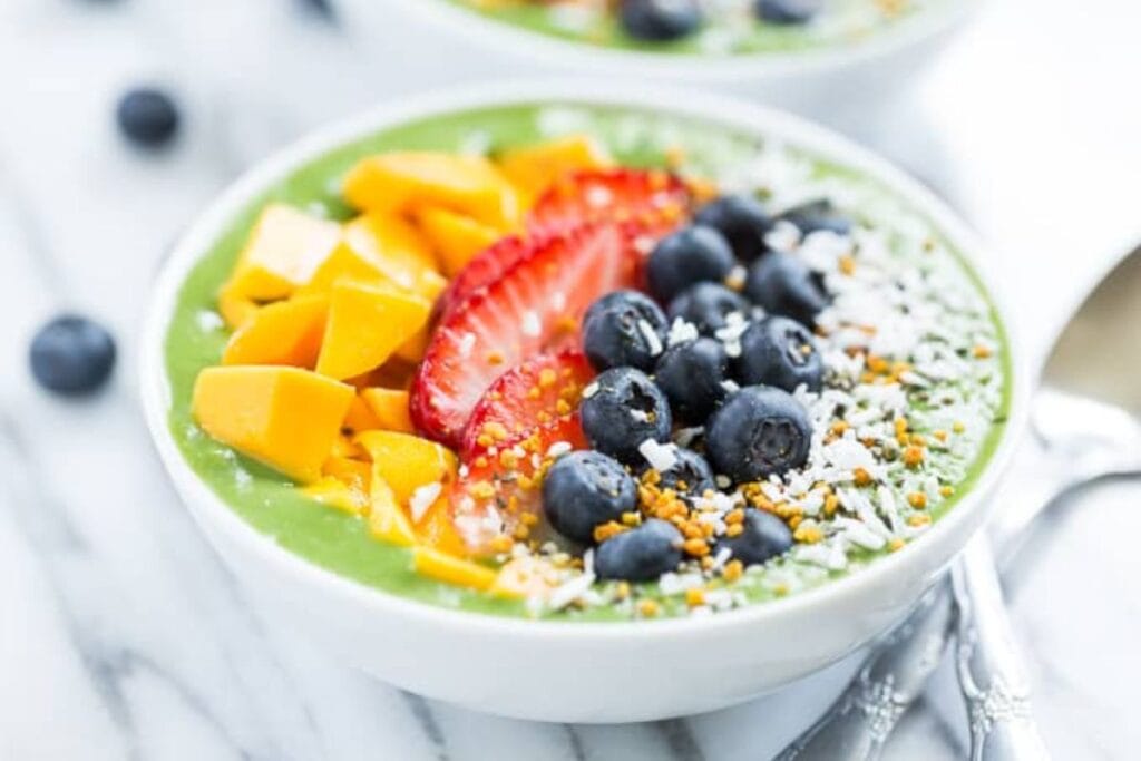 Green smoothie bowl with fresh fruit.
