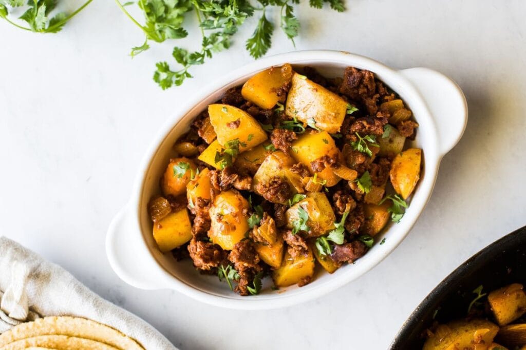 Papas con Chorizo in a bowl.