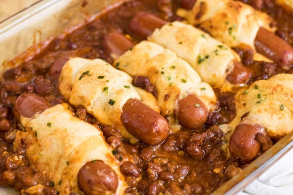 Chili cheese dog in casserole dish.