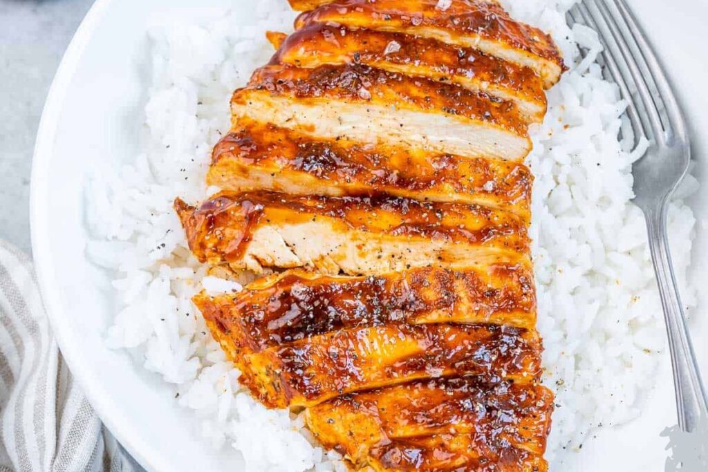 Rice with chicken bbq on a plate.