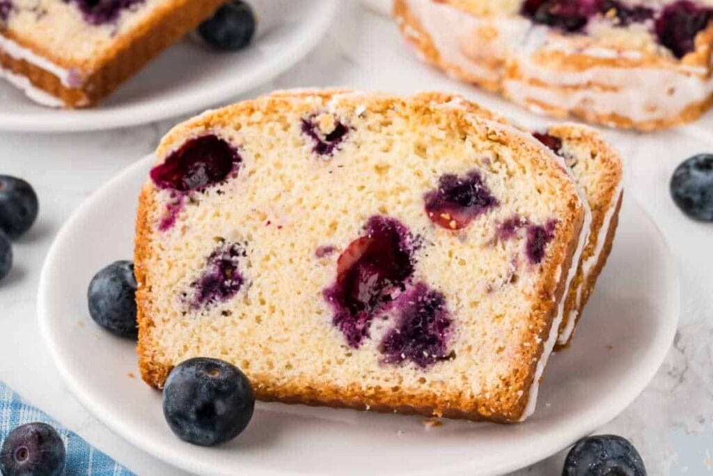 Slices of blueberry bread on a plate.