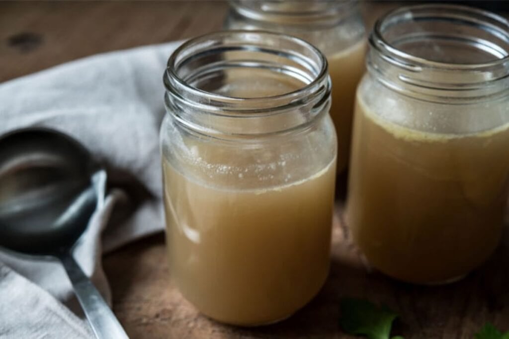 Chicken stock in jars.