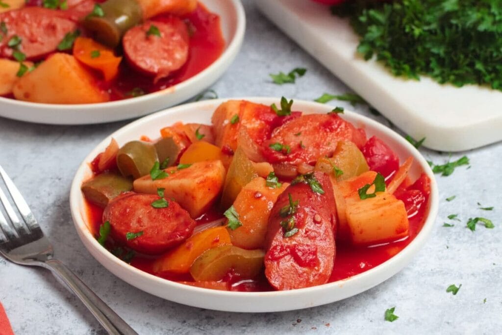 Sausage and potatoes on a plate.