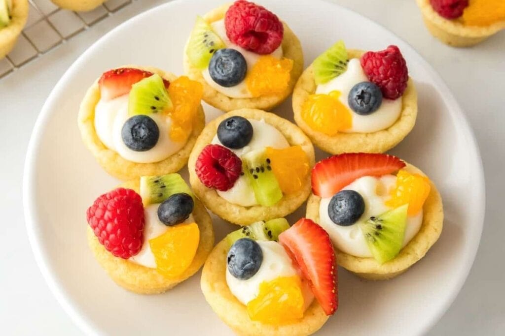 Cheesecake sugar cookie cups on a plate.