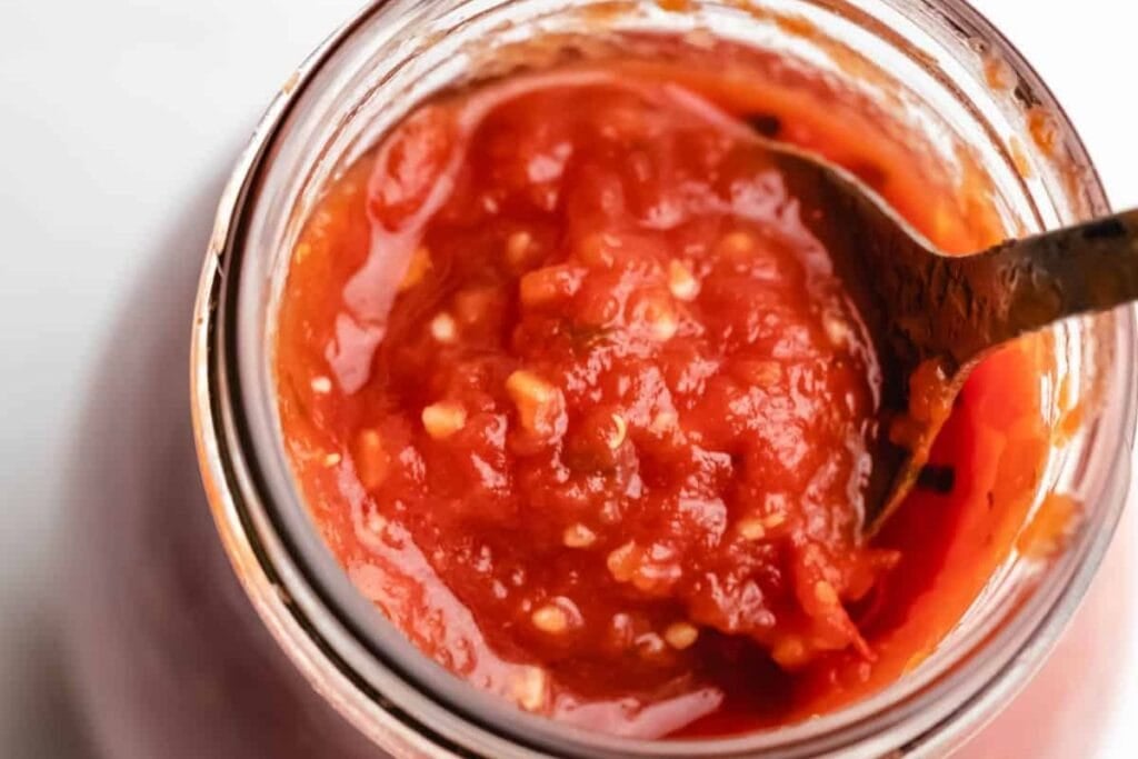 Pizza sauce in a jar.