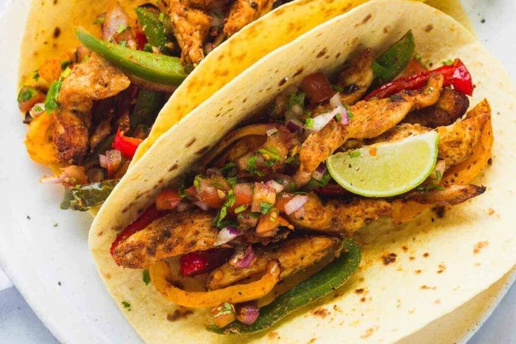 Chicken fajitas on a plate.