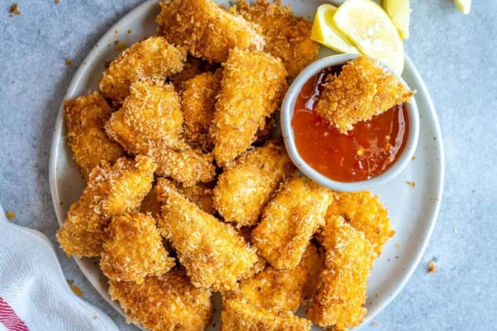 Fried chicken nuggets with dip.