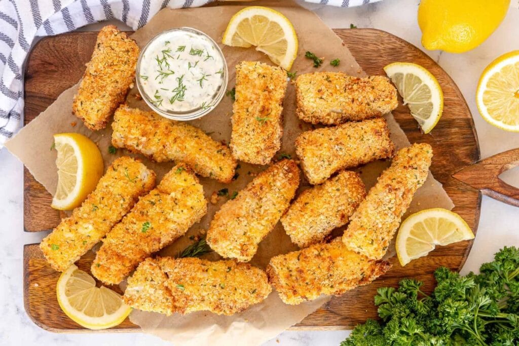 Fish sticks on a wooden board.