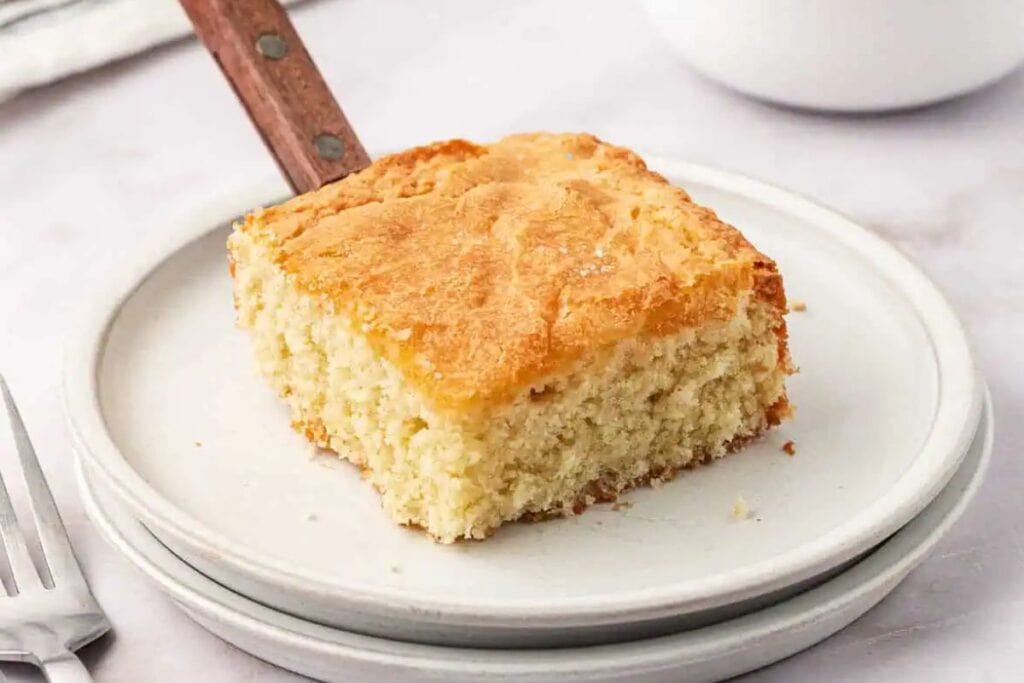 A slice of butter cake on a plate.