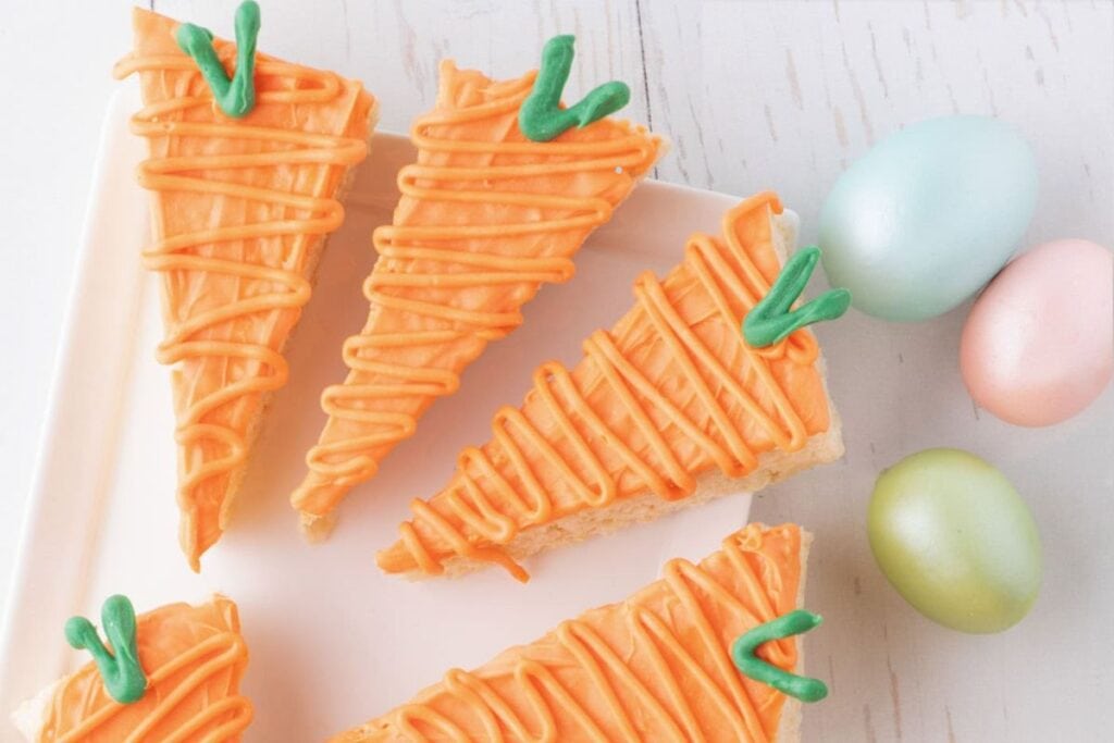 Carrot rice krispie treats on a plate.