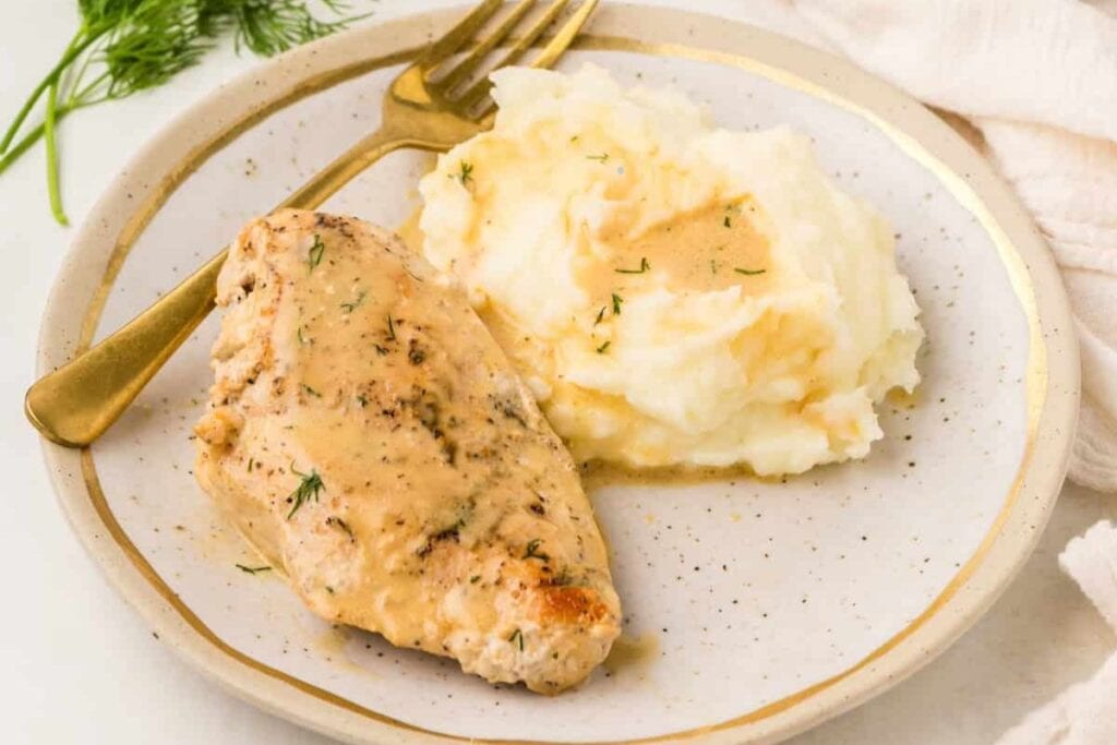 Dijon chicken on a plate.