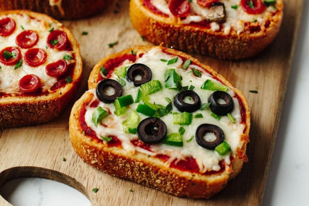 Garlic bread pizza on a wooden board.