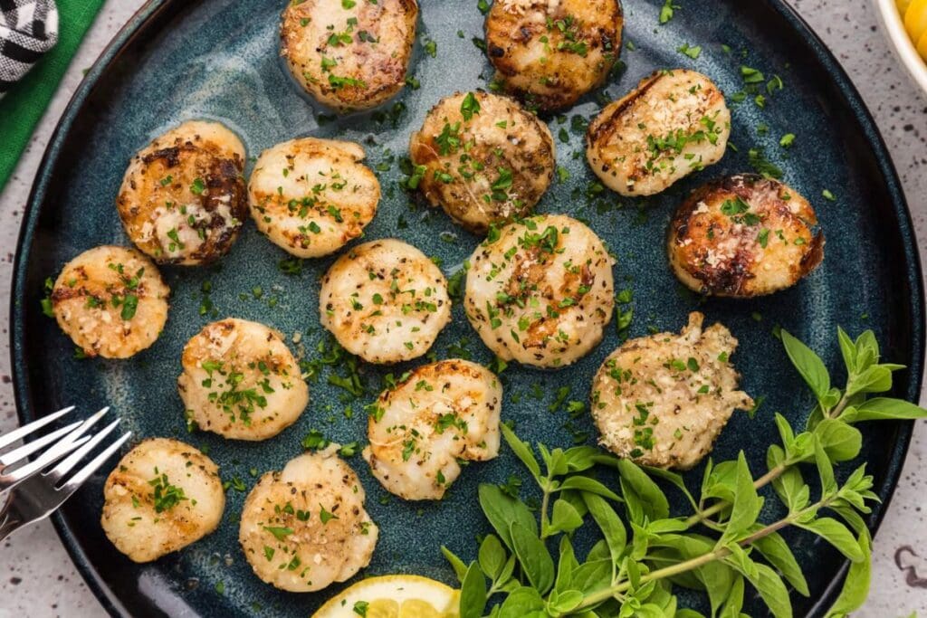 Grilled scallops on a plate.