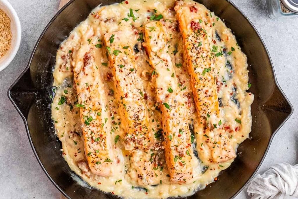 Creamy salmon in a pan.
