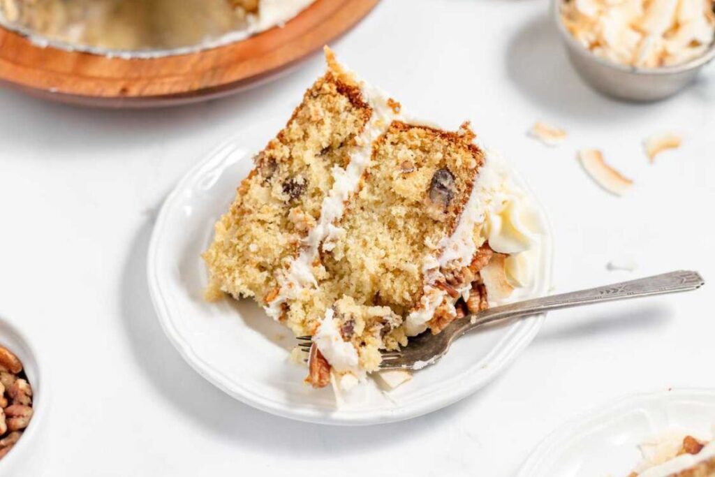 A slice of cream cake on a plate.