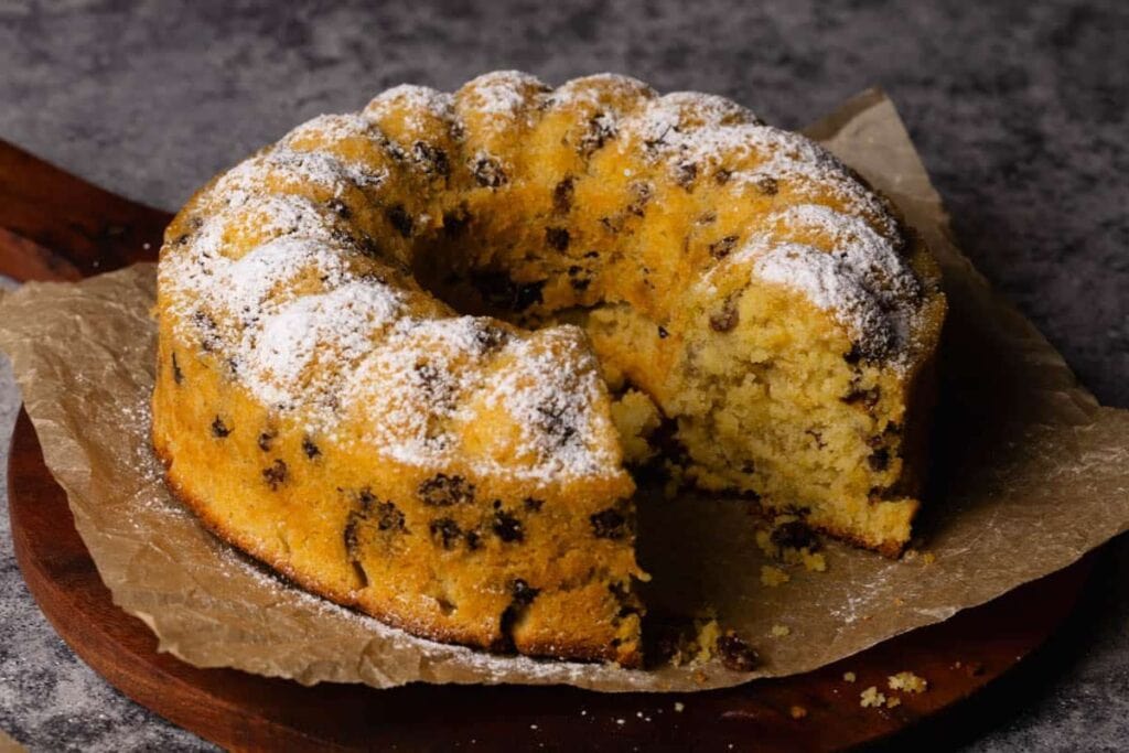 Raisin cake with a slice.