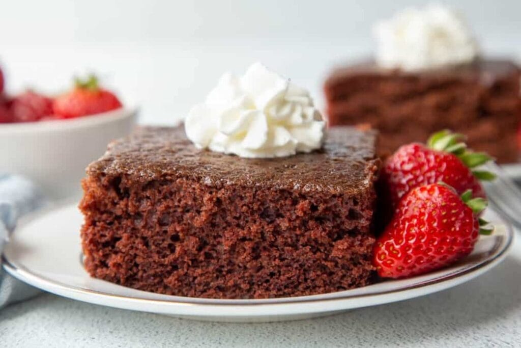 A slice of fashioned cake on a plate.