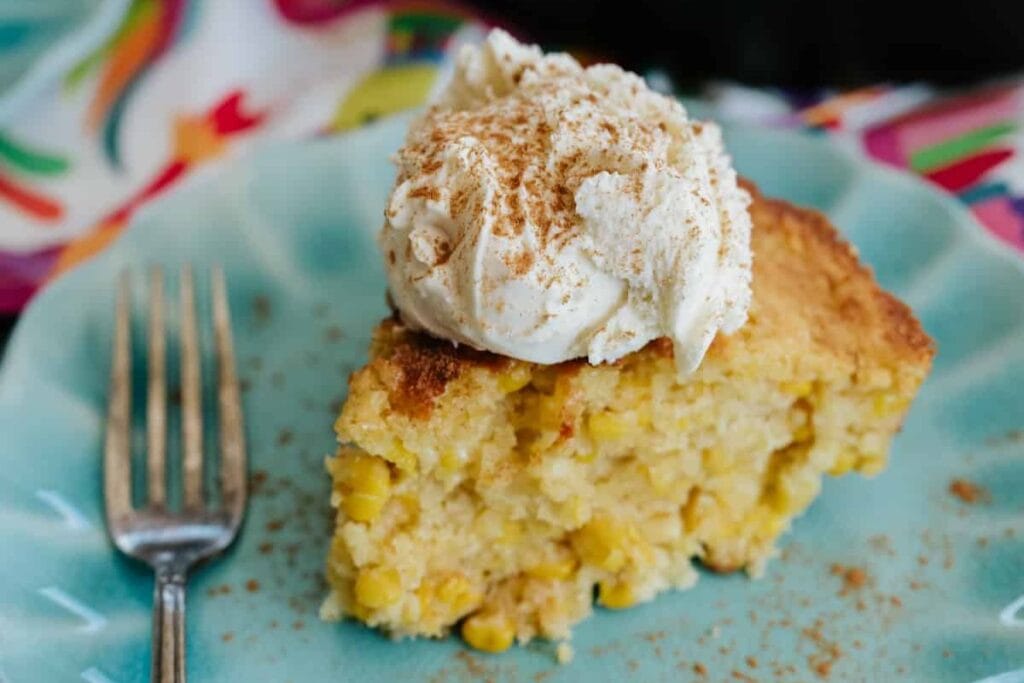 A slice of pan de elote on a plate.