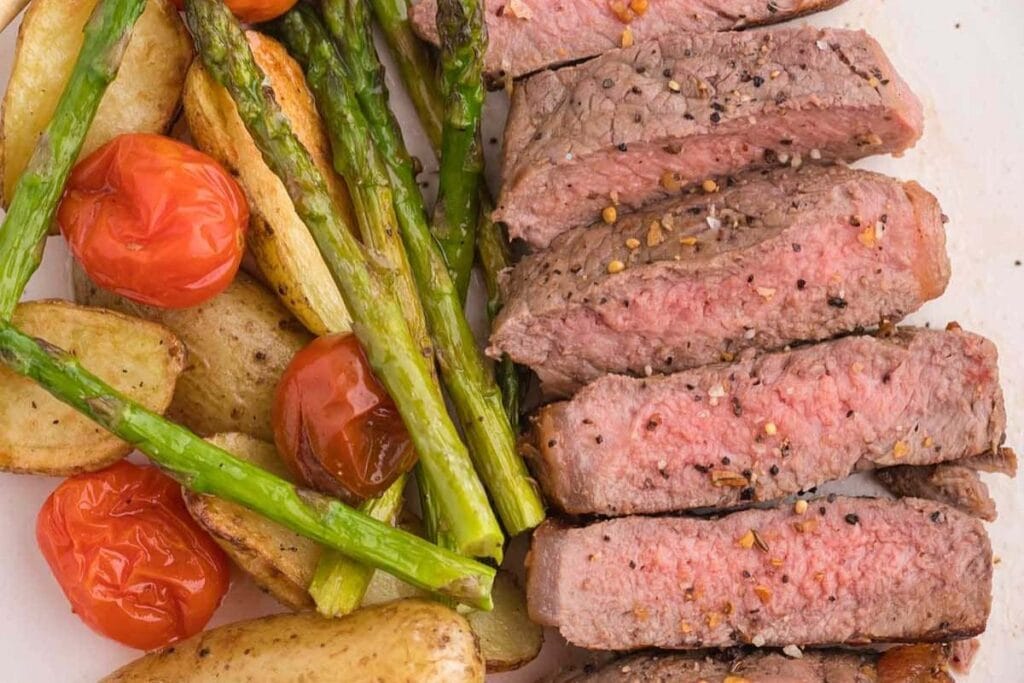 Sliced steak with veggies.