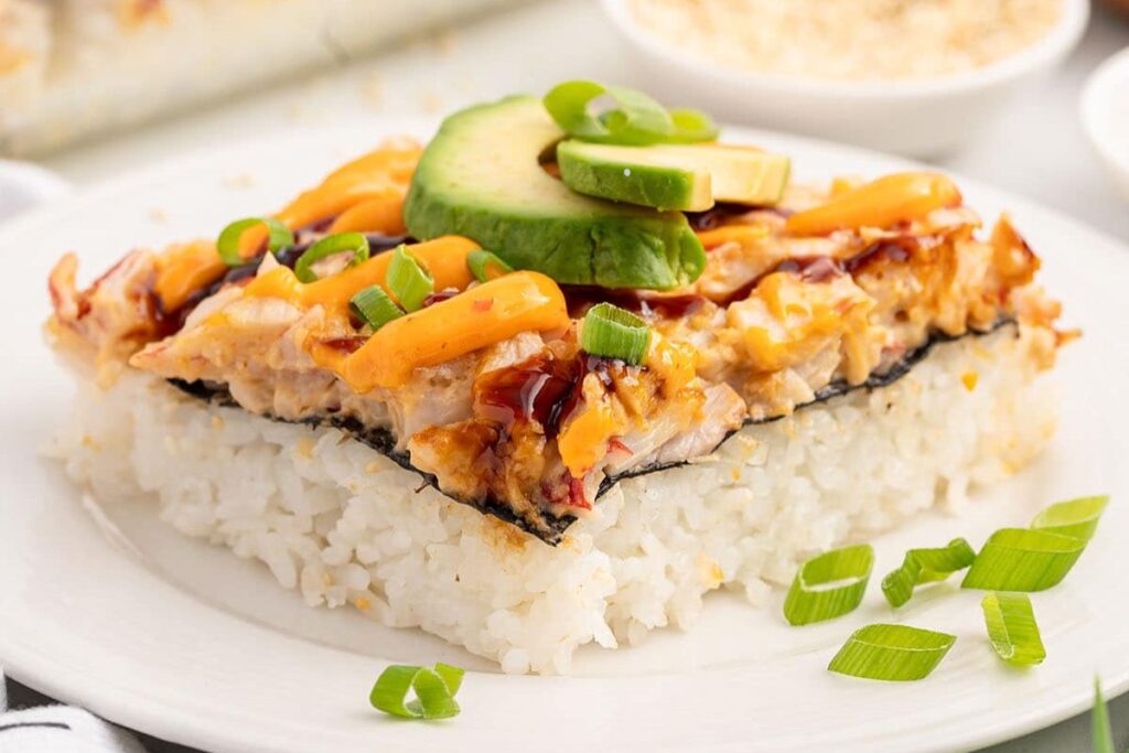 A slice of sushi bake on a plate.